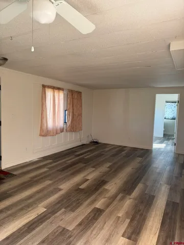 a room with wooden floor and closet