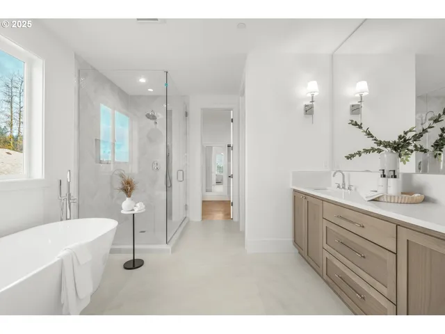 a bathroom with a sink a mirror and a shower