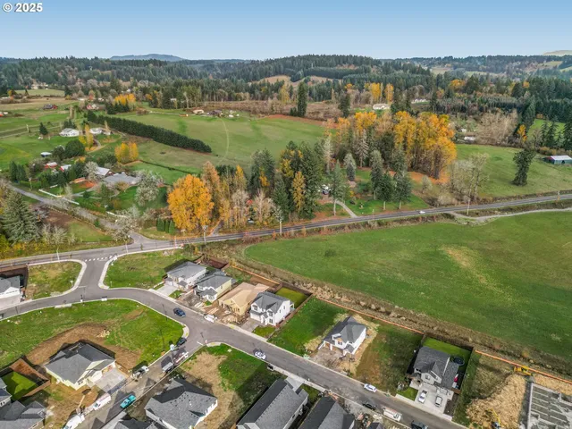 an aerial view of a city with lake view