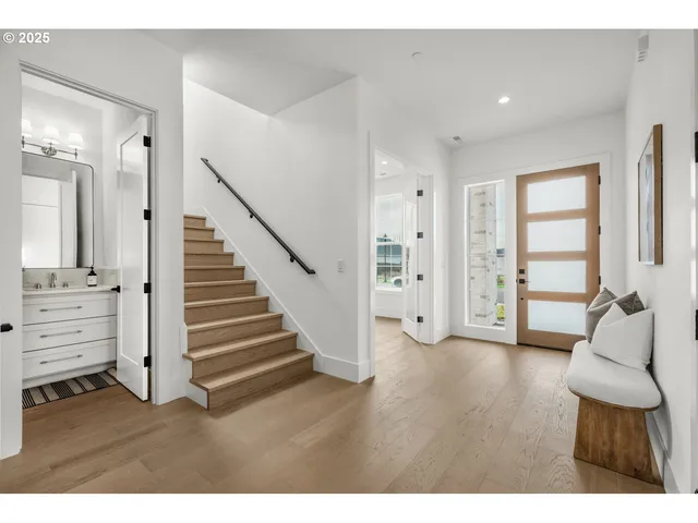 a view of room with furniture and wooden floor