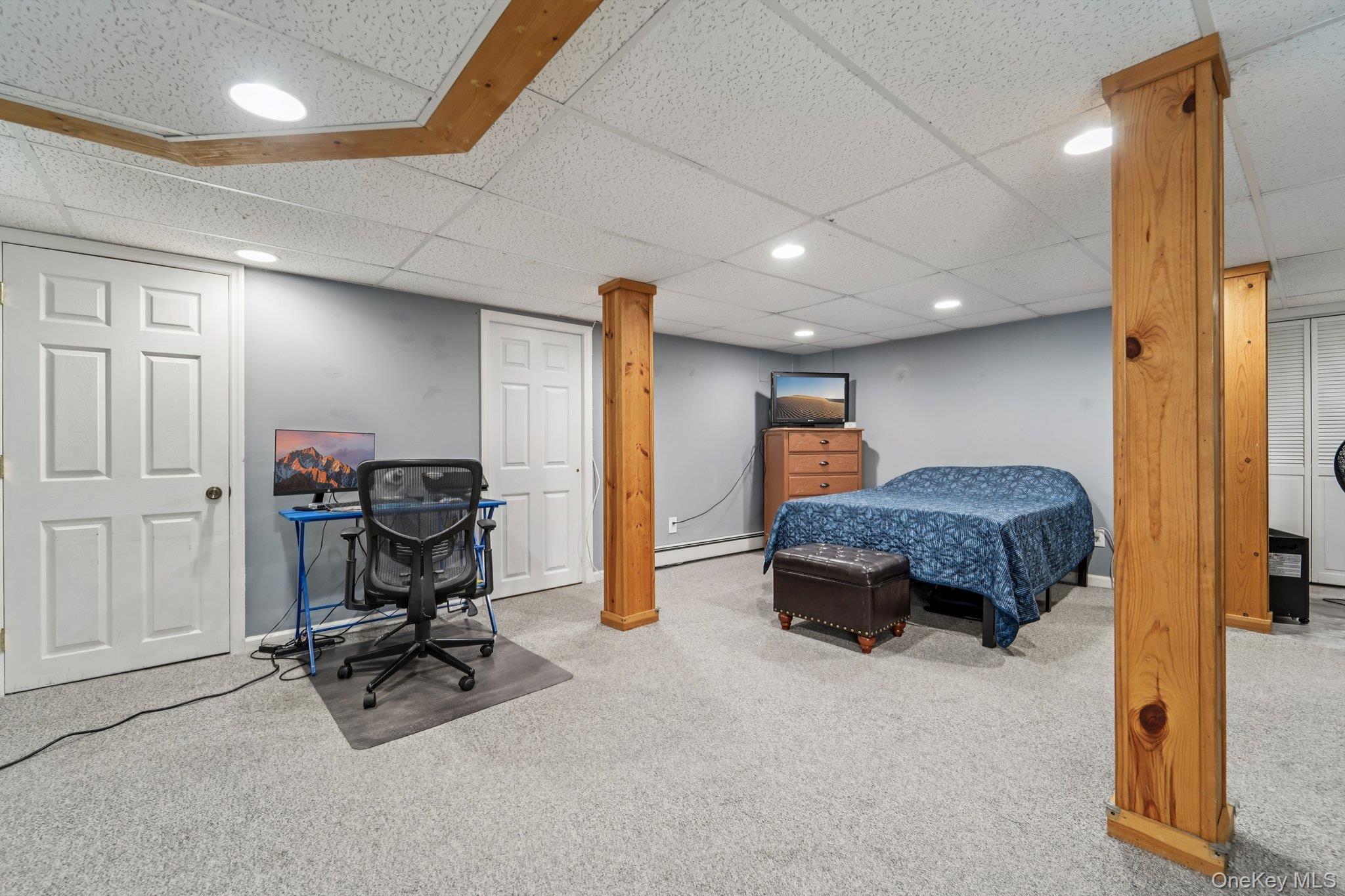 10 Ward Street Suffern, NY 10901 - Photo 26 of 34 Carpeted bedroom with recessed lighting, a baseboard heating unit, and a paneled ceiling
