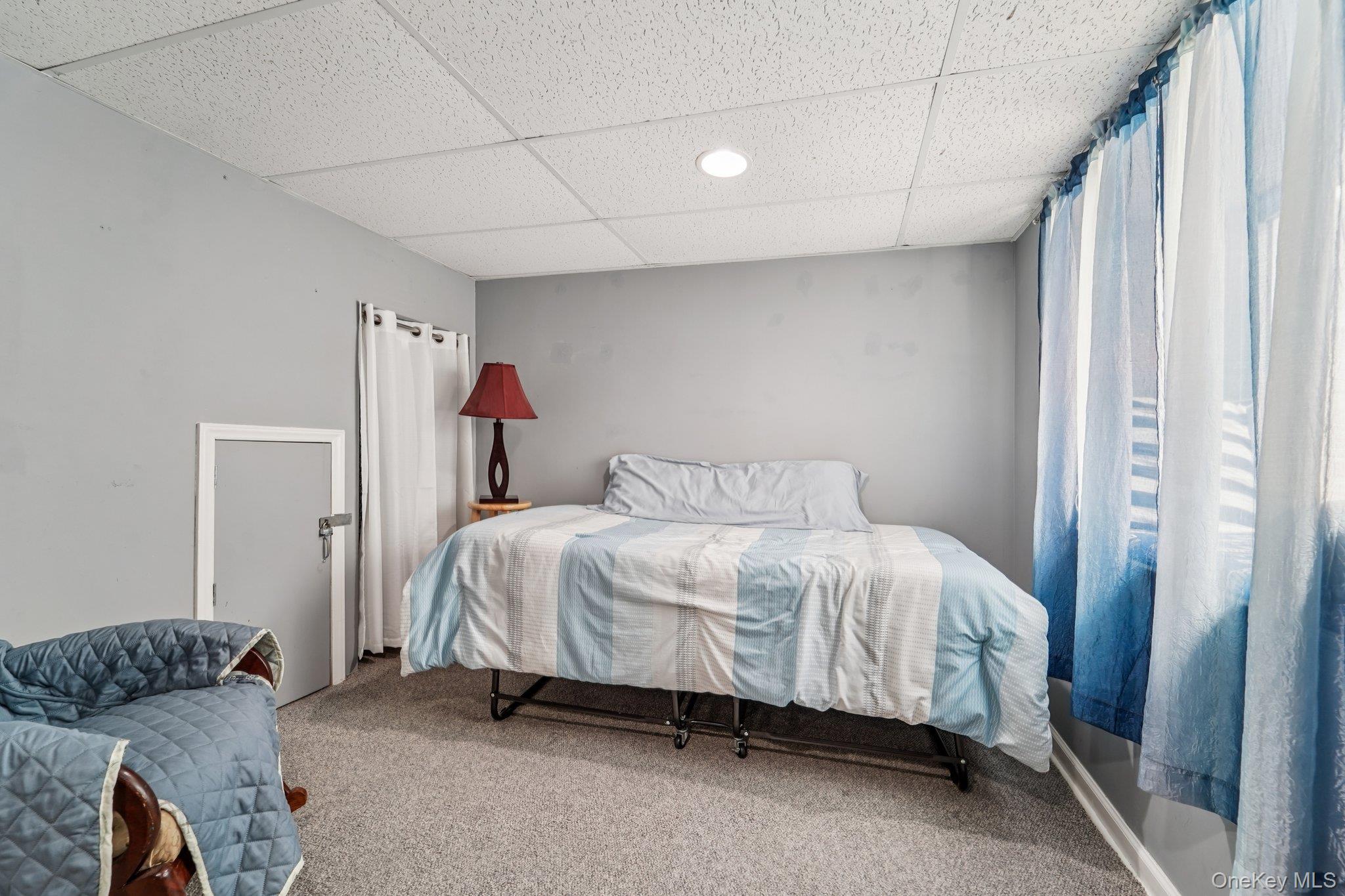 10 Ward Street Suffern, NY 10901 - Photo 27 of 34 Carpeted bedroom featuring a paneled ceiling