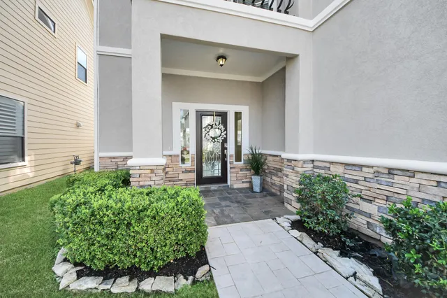 a front view of a house with garden
