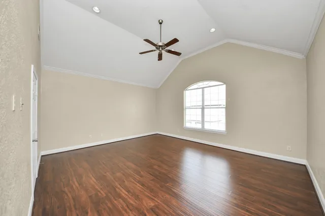 a en suite bathroom with a granite countertop sink mirror and double