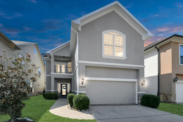 an aerial view of houses with outdoor space