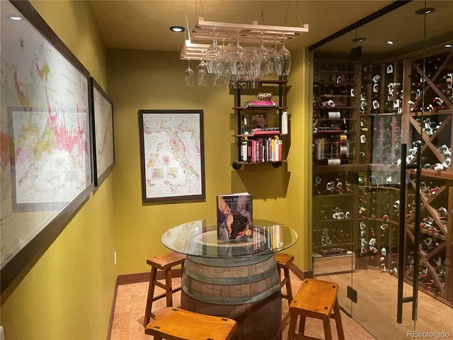 a view of a dining room with furniture and chandelier