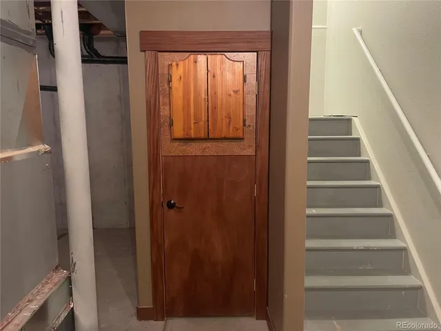 a view of a room with furniture and chandelier