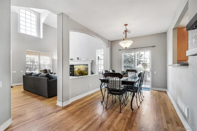 a view of a dining room with furniture window and wooden floor