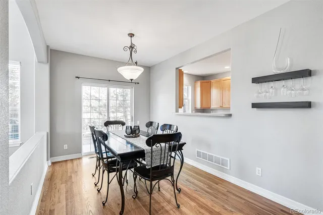 a dining room with furniture and window