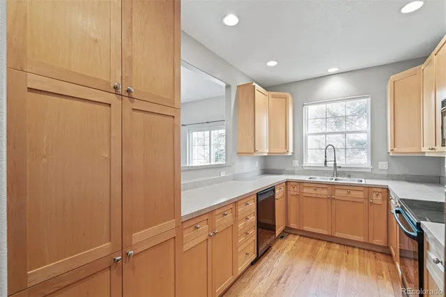 a kitchen with sink cabinets and window
