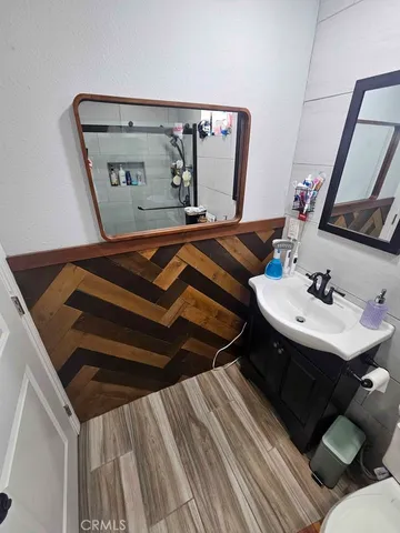 a bathroom with a sink and a mirror