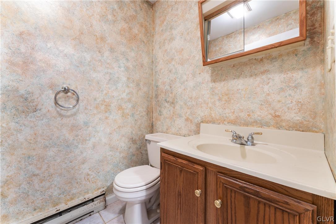 217 Tanite Road Stroudsburg, PA 18360 - Photo 4 of 40 a bathroom with a sink a toilet and mirror