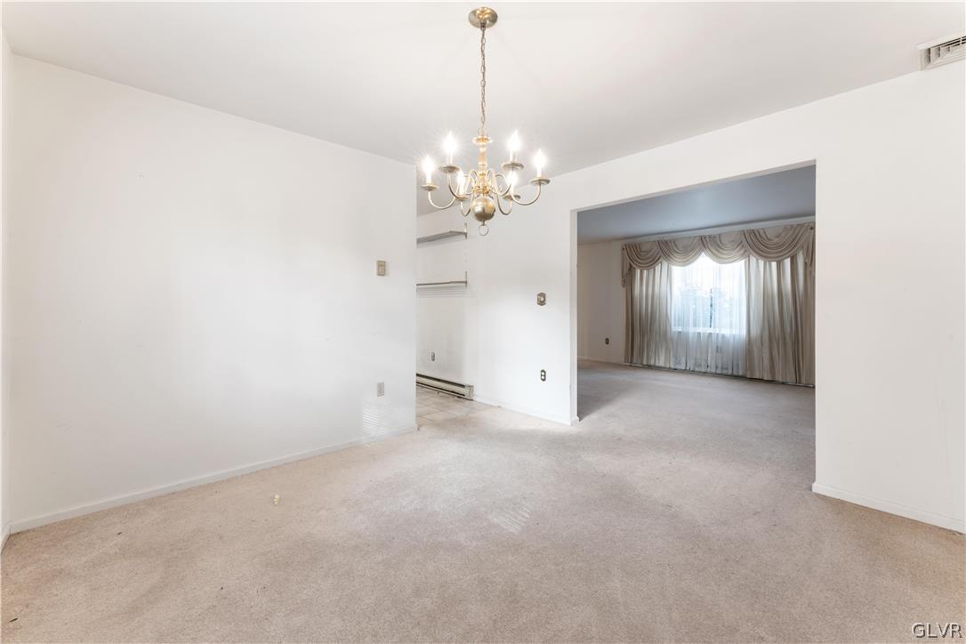 217 Tanite Road Stroudsburg, PA 18360 - Photo 8 of 40 a view of a chandelier in big room and chandelier fan