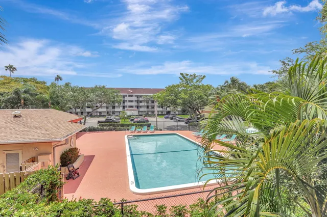 a view of a swimming pool and a yard