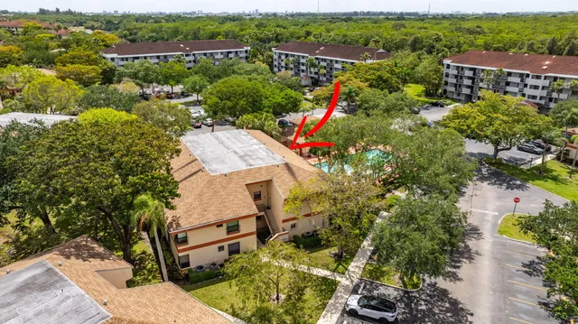 an aerial view of a house with a lake view