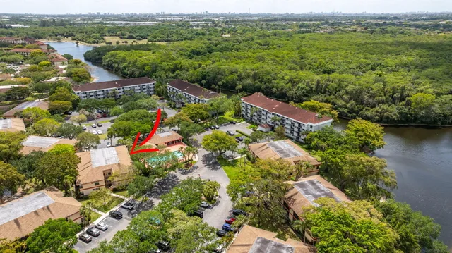 an aerial view of residential house with outdoor space and swimming pool
