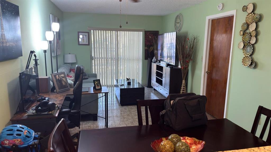 3181 Southwest 13th Street, Unit 114 Miami, FL 33145 - Photo 17 of 17 a living room with furniture and a window