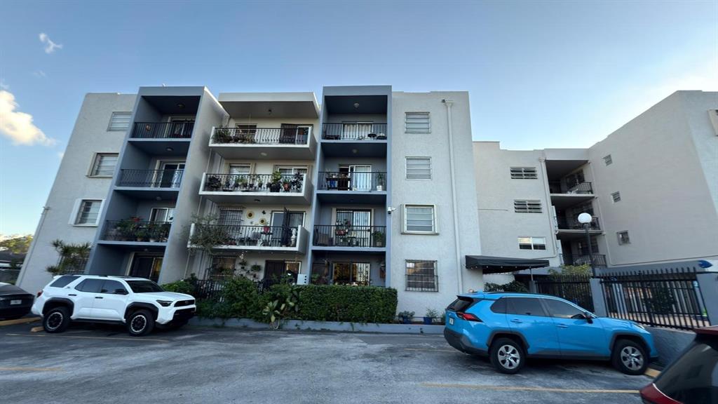 3181 Southwest 13th Street, Unit 114 Miami, FL 33145 - Photo 4 of 17 a car parked in front of a building
