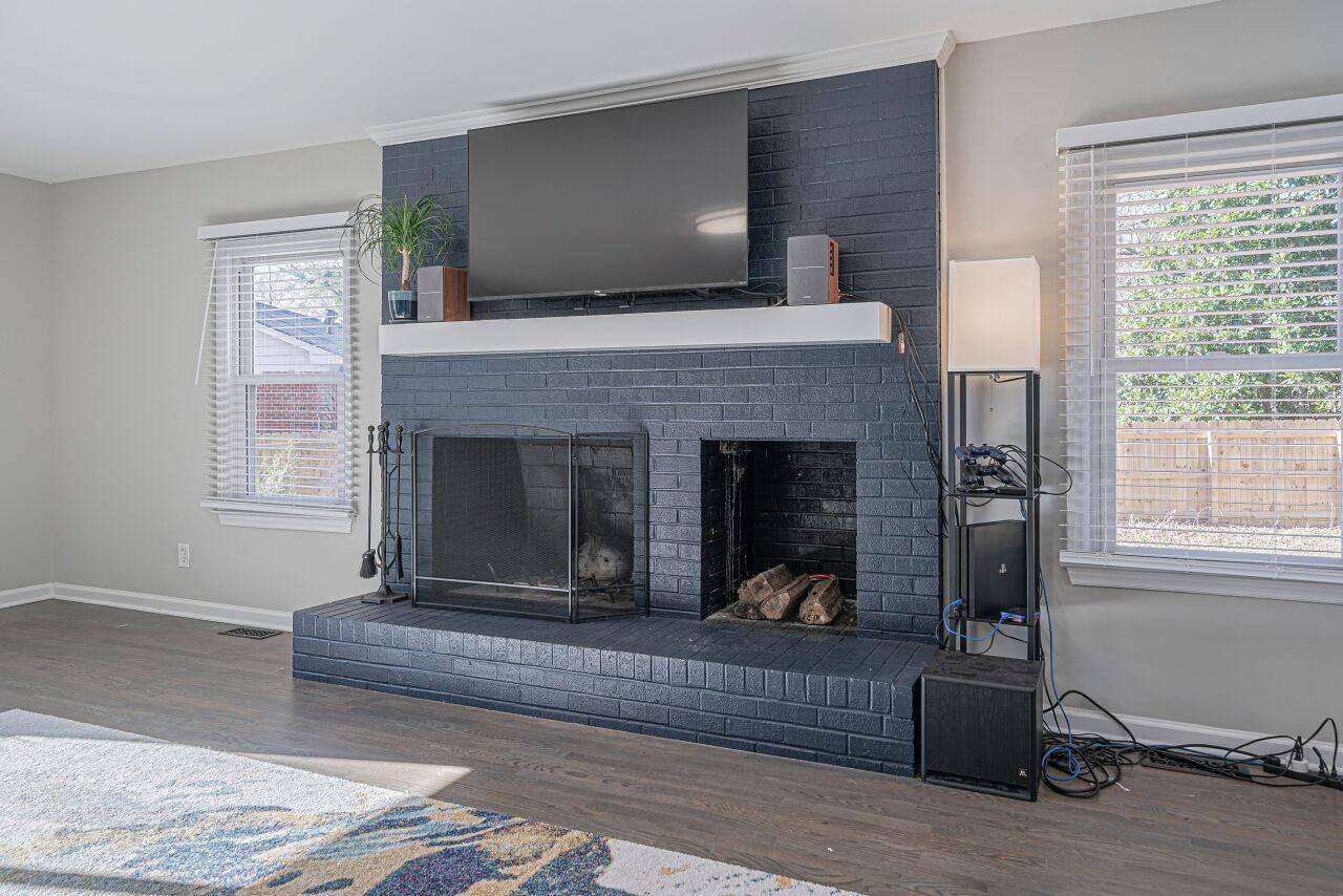 3322 Bell Drive Raleigh, NC 27610 - Photo 17 of 35 a living room with furniture and a fireplace