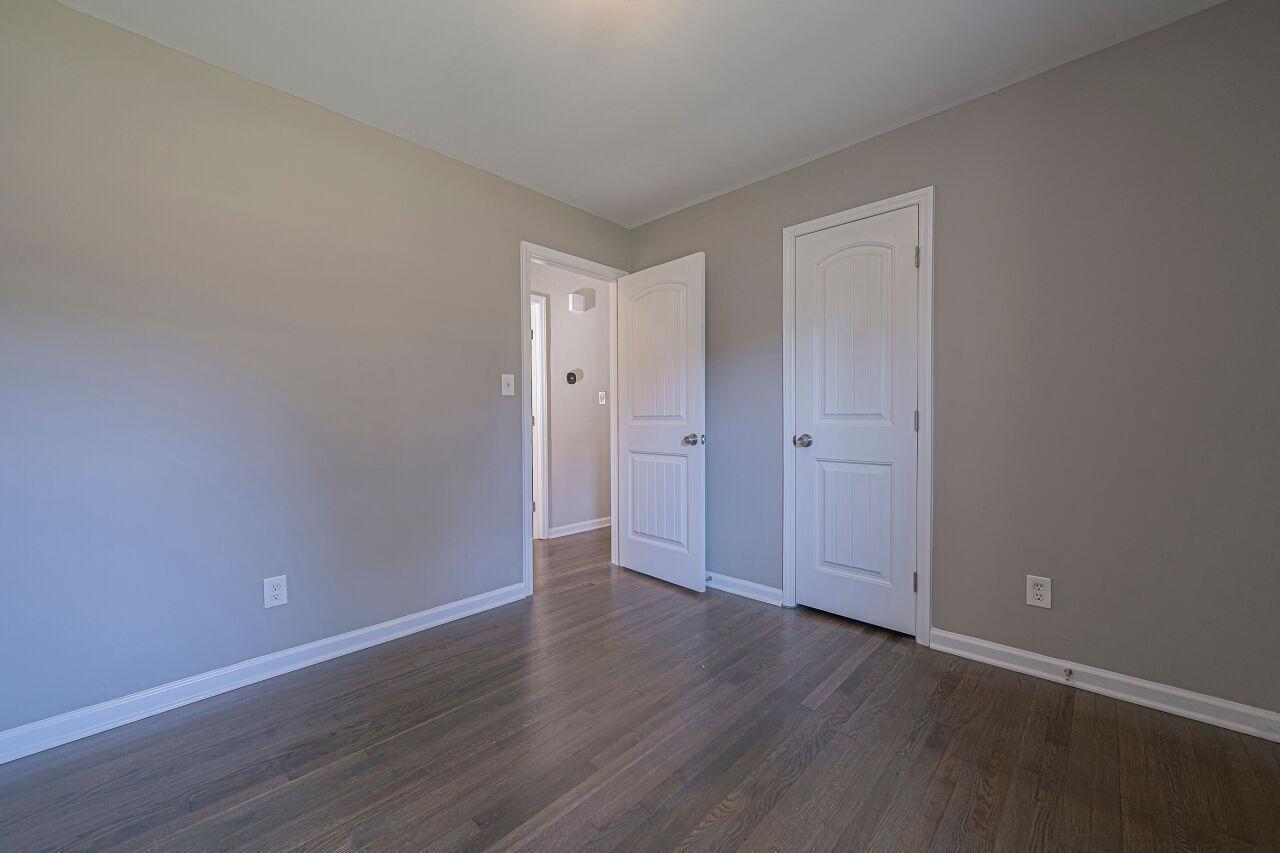 3322 Bell Drive Raleigh, NC 27610 - Photo 18 of 35 a view of an empty room with wooden floor