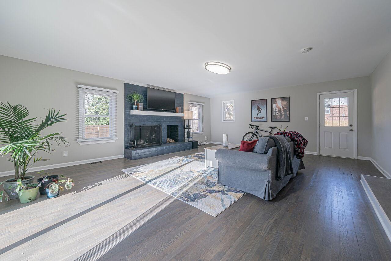 3322 Bell Drive Raleigh, NC 27610 - Photo 20 of 35 a living room with furniture and a flat screen tv