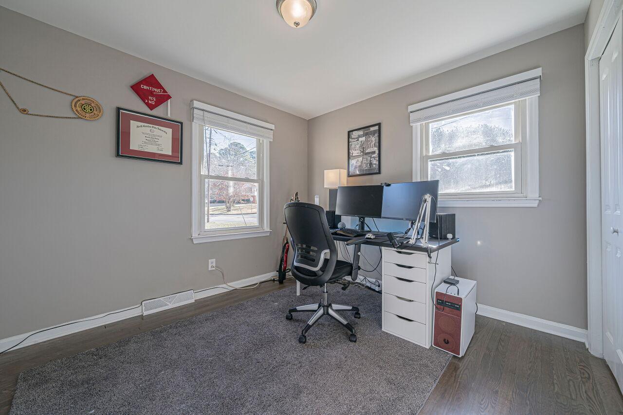 3322 Bell Drive Raleigh, NC 27610 - Photo 21 of 35 a view of a workspace with furniture and a window