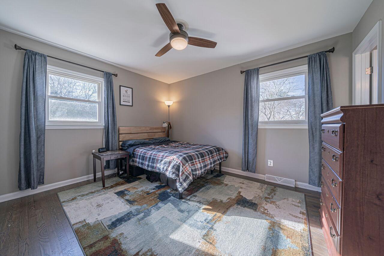 3322 Bell Drive Raleigh, NC 27610 - Photo 22 of 35 a bedroom with a bed dresser and a window