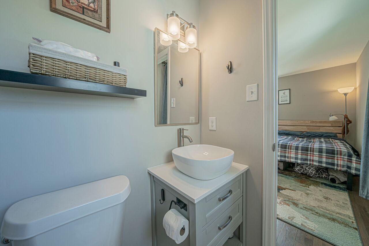 3322 Bell Drive Raleigh, NC 27610 - Photo 23 of 35 a bathroom with a sink toilet and shower