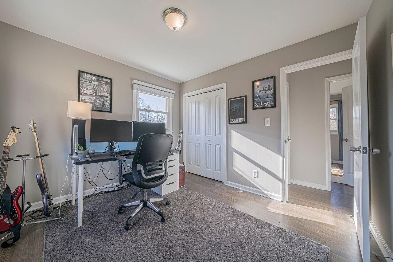 3322 Bell Drive Raleigh, NC 27610 - Photo 24 of 35 a view of a workspace with furniture and a window