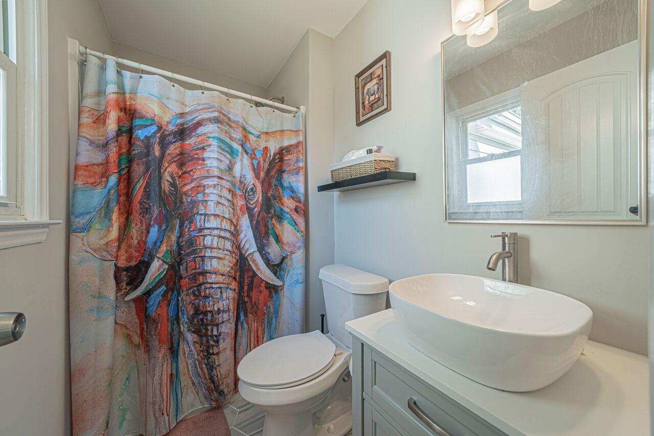3322 Bell Drive Raleigh, NC 27610 - Photo 25 of 35 a bathroom with a sink and a toilet
