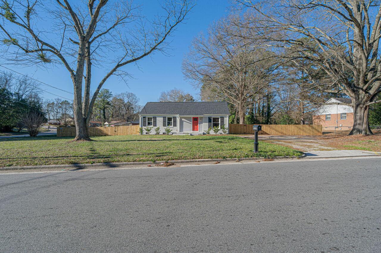 3322 Bell Drive Raleigh, NC 27610 - Photo 34 of 35 a front view of a house with a yard and garage