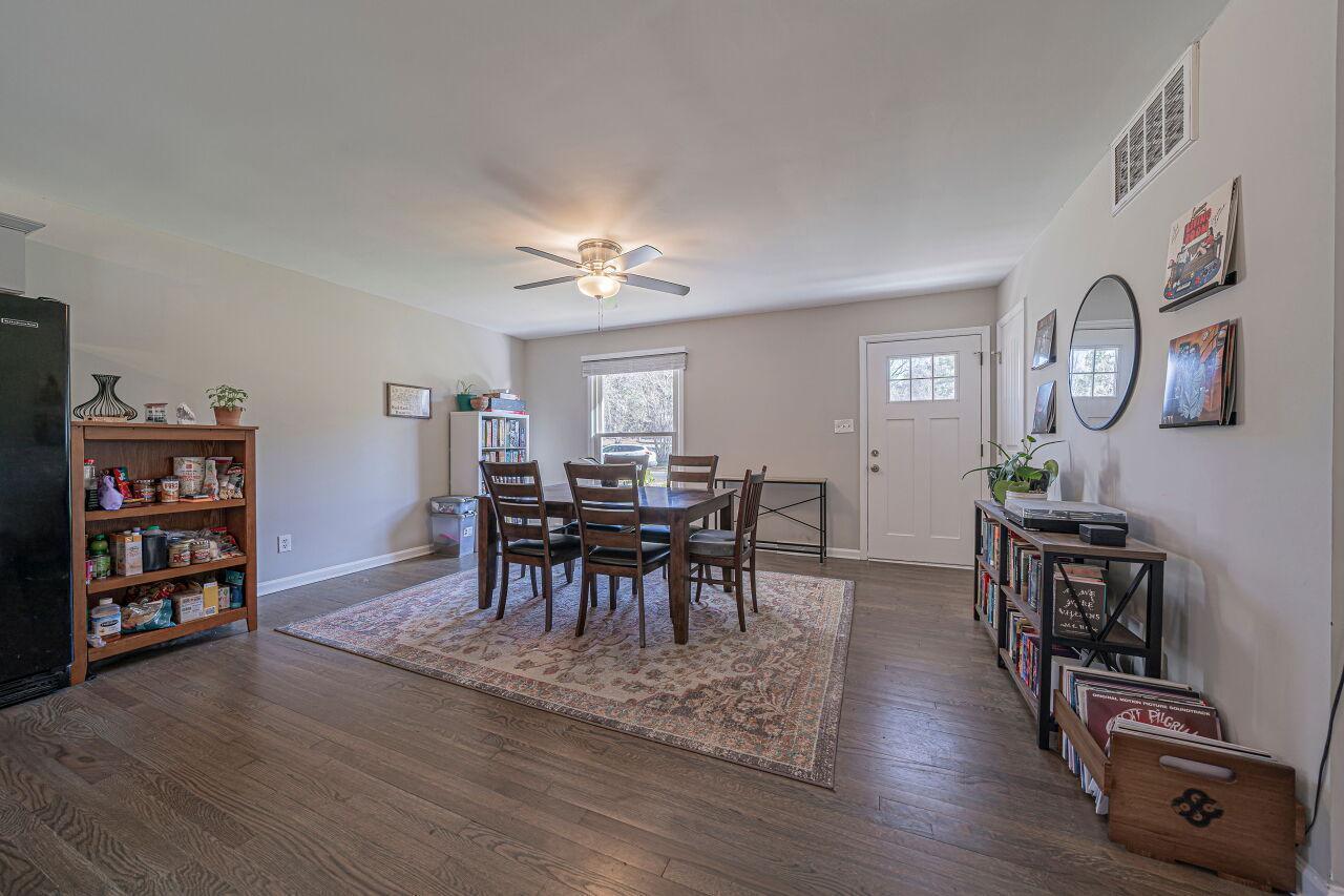 3322 Bell Drive Raleigh, NC 27610 - Photo 6 of 35 a view of a a dining room with furniture window and wooden floor