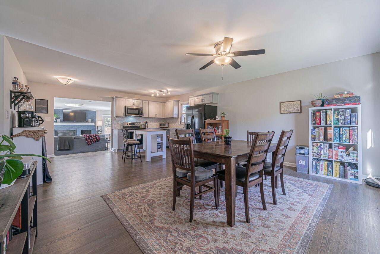 3322 Bell Drive Raleigh, NC 27610 - Photo 8 of 35 a view of a dining room with furniture and wooden floor