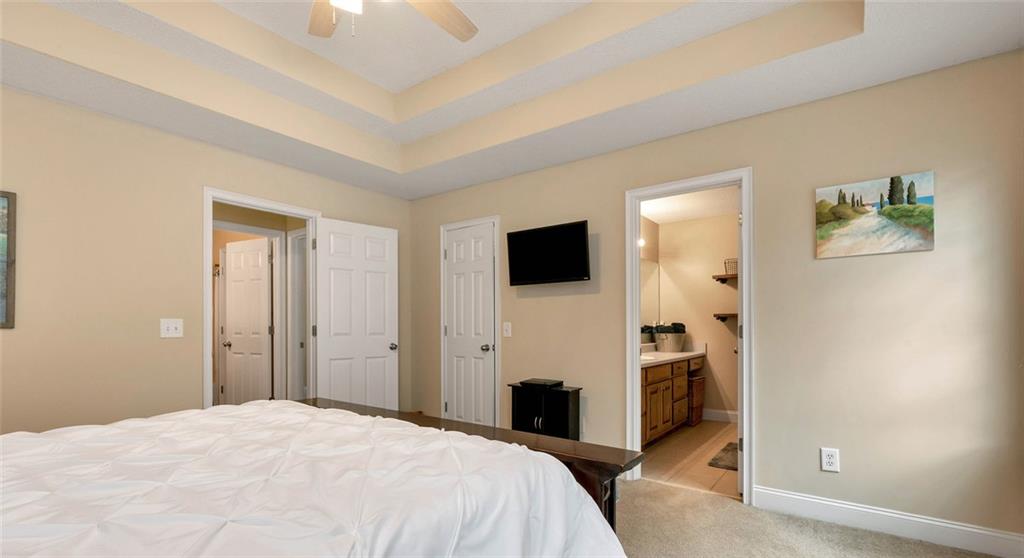 1044 Lothridge Road Cleveland, GA 30528 - Photo 25 of 40 a bedroom with a bed and a flat screen tv