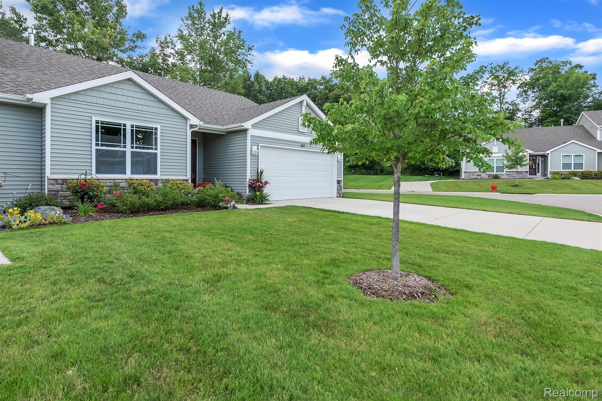 147 Sedum Road Howell, MI 48843 - Photo 30 of 34 Lush Lawn and Meticulous Landscaping