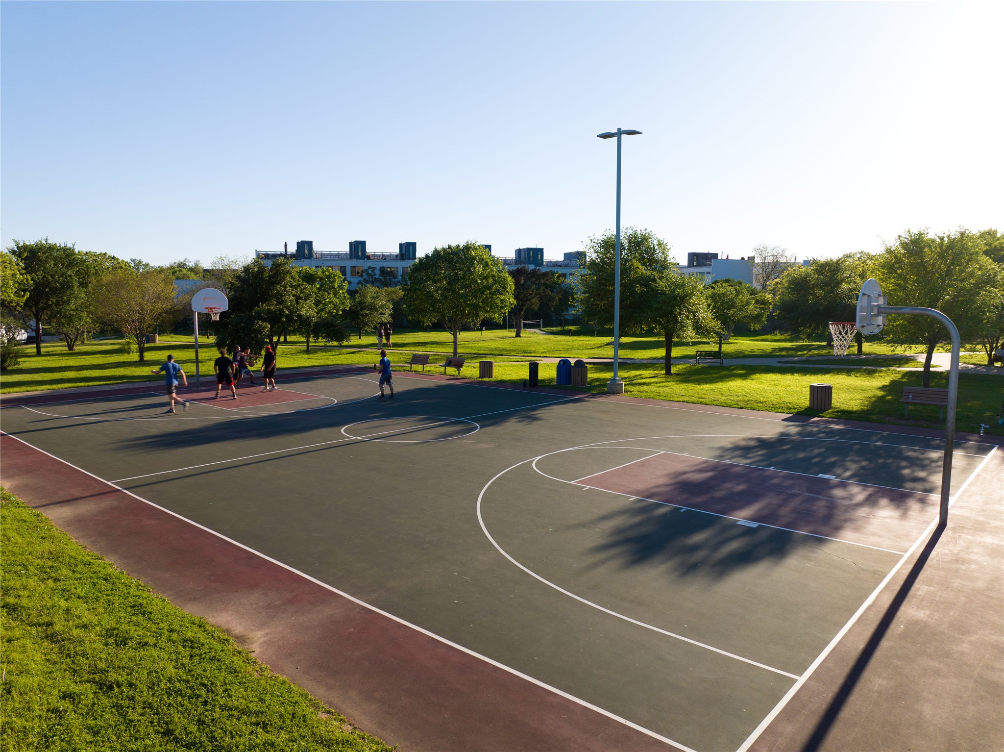 4801 South Congress Avenue, Unit H5 Austin, TX 78745 - Photo 37 of 39 View of sport court featuring community basketball court and a yard