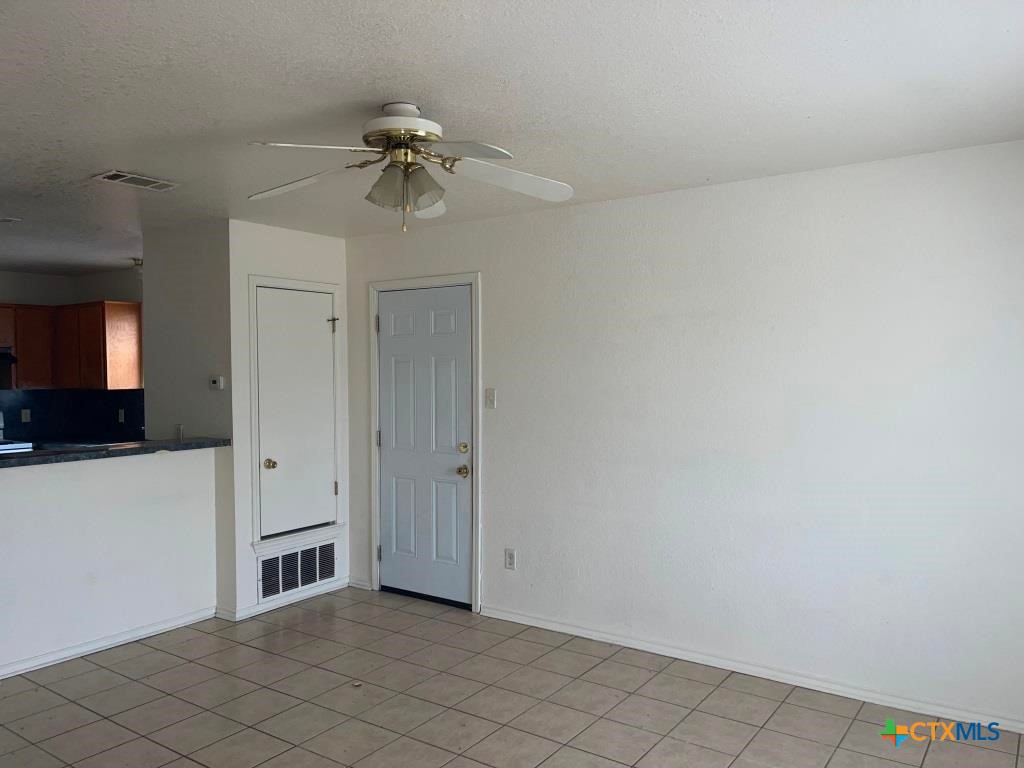 4507 Deek Drive, Unit A Killeen, TX 76549 - Photo 20 of 27 a view of a hallway with closet and a chandelier fan