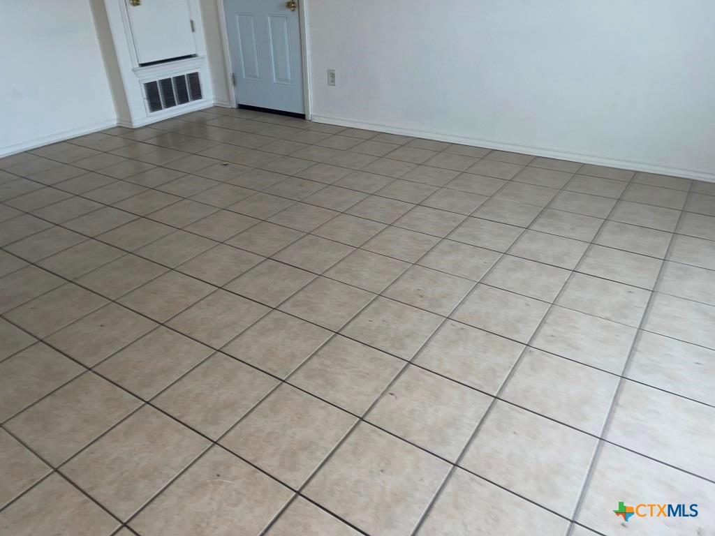 4507 Deek Drive, Unit A Killeen, TX 76549 - Photo 21 of 27 a view of an empty room and staircase