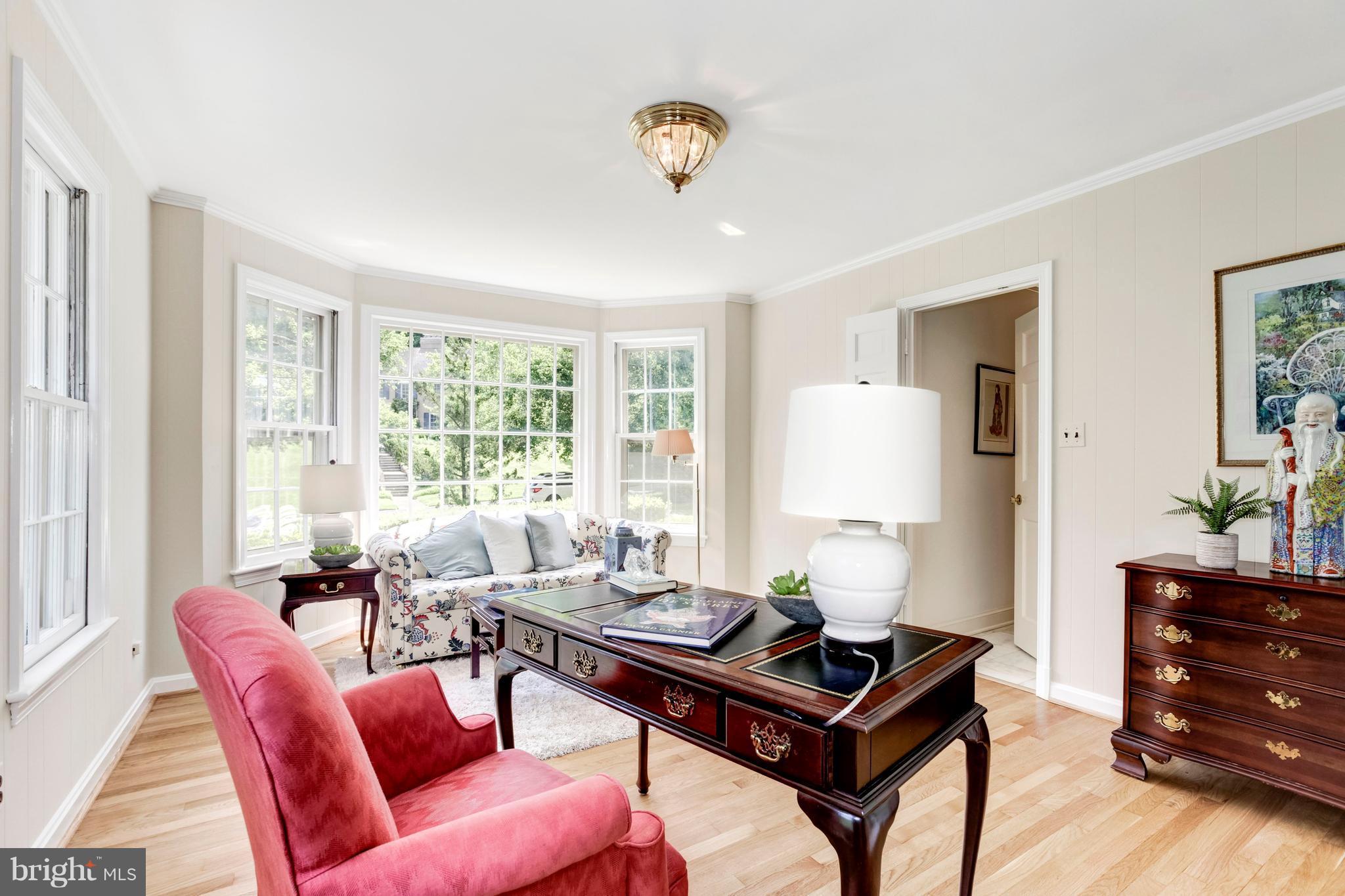 Main level home office space is sunny and spacious