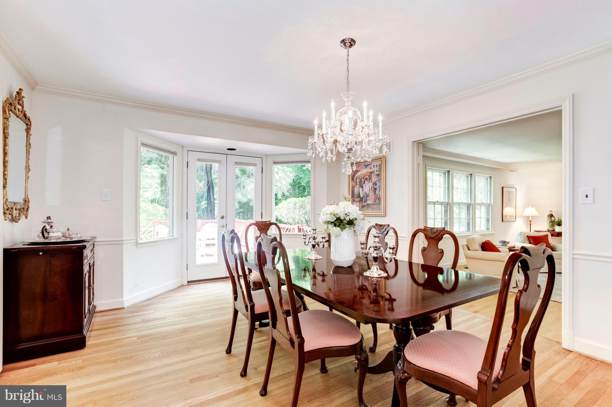Elegant formal dining room opens to the deck