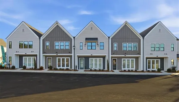 a view of multiple houses with a street