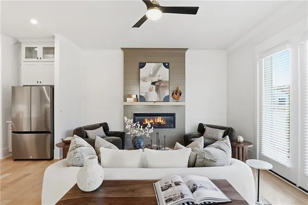 a living room with furniture and a fireplace