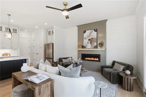a living room with furniture and a fireplace