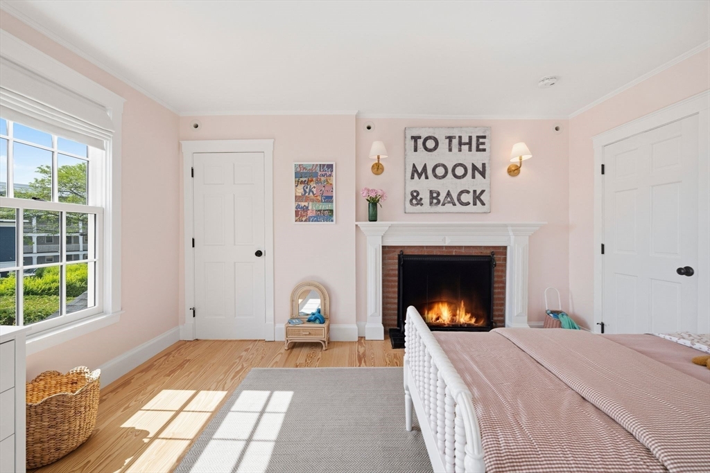 33 Franklin Street Marblehead, MA 01945 - Photo 21 of 42 a bed room with a bed and a fireplace