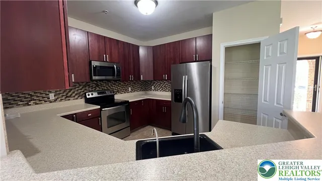 a kitchen with a sink and a window