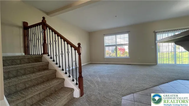 a view of an empty room with stairs