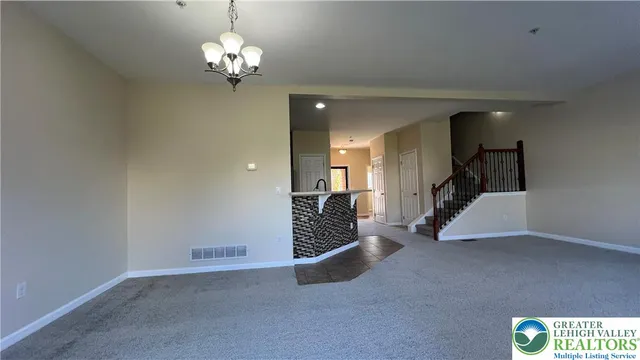 a view of a hallway with staircase