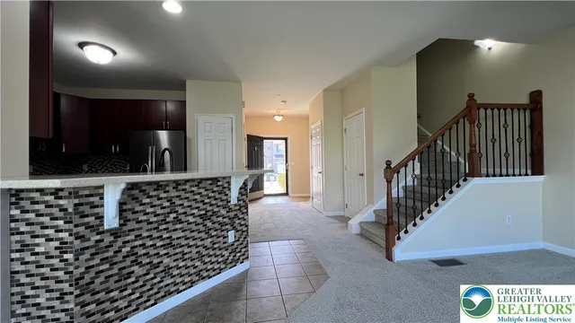 a kitchen with stainless steel appliances a refrigerator and a stove
