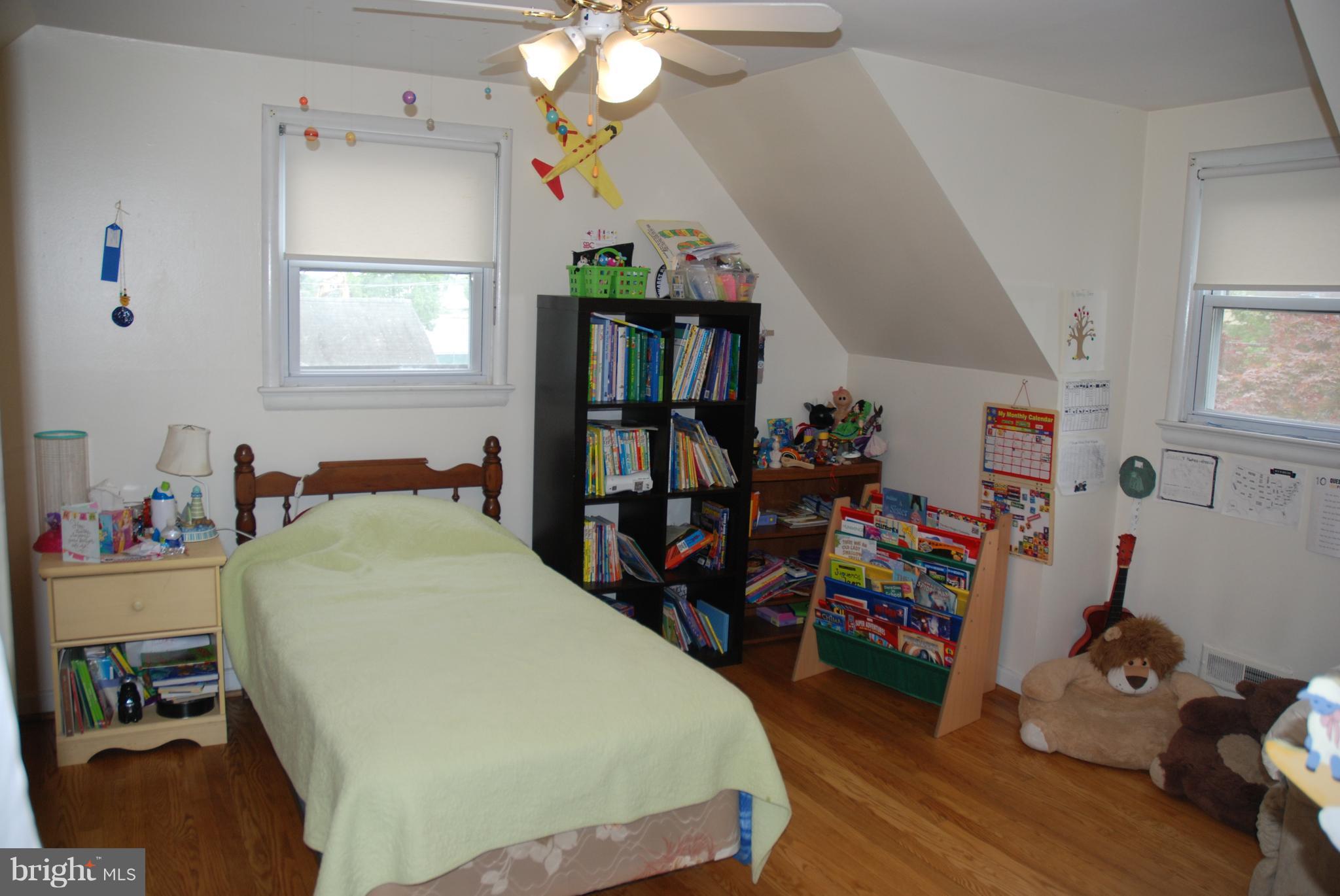 12603 Bluhill Road Silver Spring, MD 20906 - Photo 11 of 21 a bed room with a bed and a book shelf
