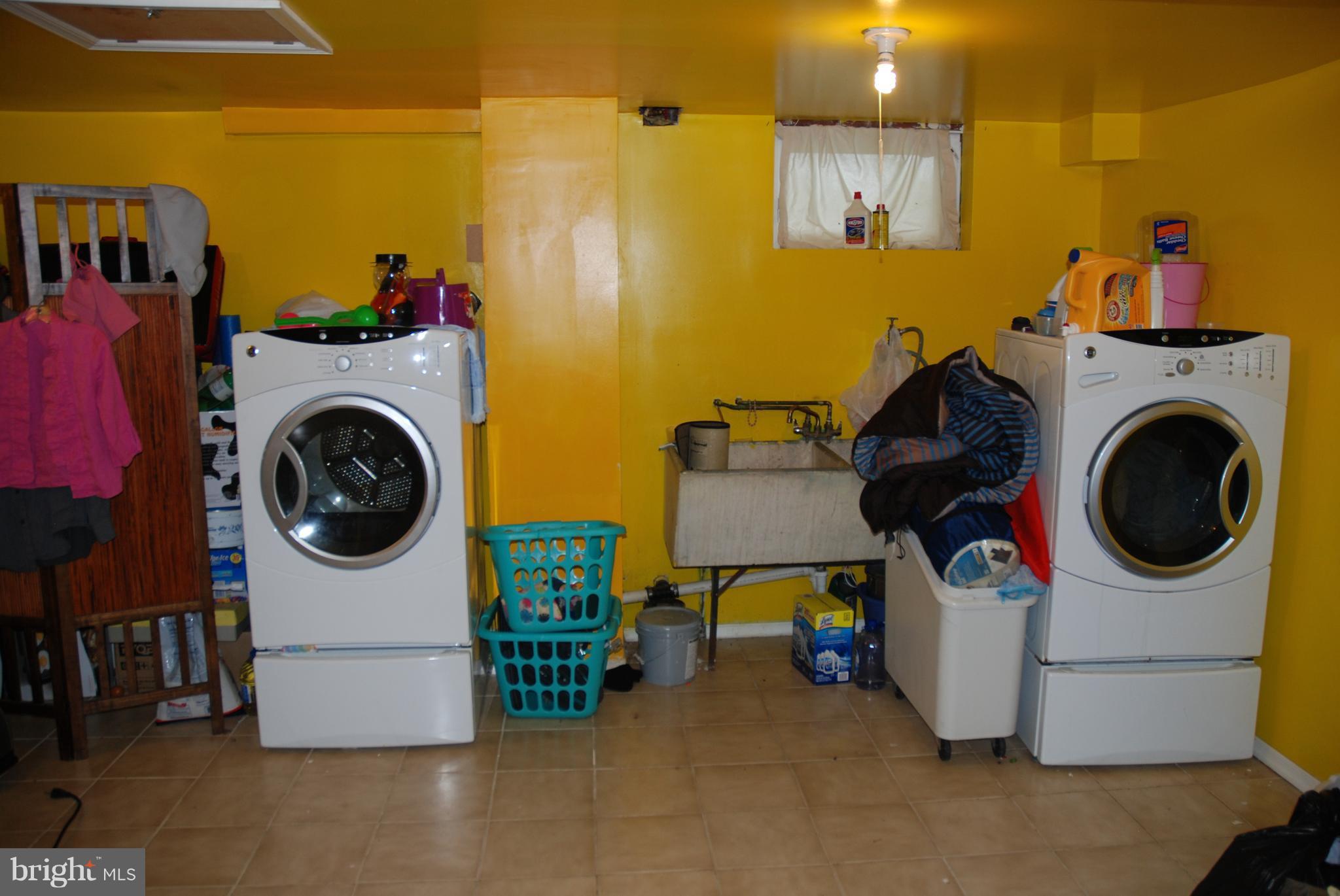 12603 Bluhill Road Silver Spring, MD 20906 - Photo 16 of 21 a utility room with dryer and washer